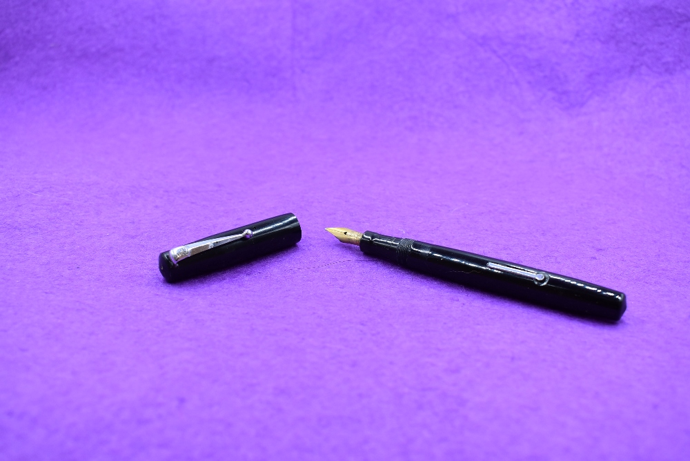 A Mabie Todd & Co Swan Self filler leverfill in black with Swan No2 nib. Approx 13cm