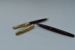 A Parker 65 Fountain pen and mechanical pencil set in burgundy with rolled gold cap