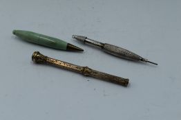 A retractable seal top pencil, a hallmarked silver mechanical pencil A/F and a small mechanical