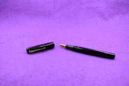 A Mabie Todd & Co Self filler leverfill fountain pen in black with chased design with Swan No1