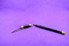 A Mabie Todd and Bart 'The Swan Pen' dipping pen with gold band to cap and decorative gold tips with