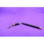 A Mabie Todd and Bart 'The Swan Pen' dipping pen with gold band to cap and decorative gold tips with