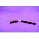A Mabie Todd & Co Blackbird Self filler Leverfill fountain pen, in red marble, with a single band to