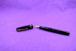 A Mabie Todd & Co Swan 6260 Self filler leverfill fountain pen in black with two narrow gold band to