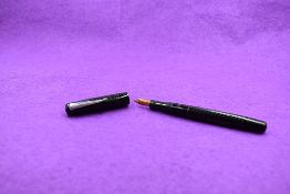 A Mabie Todd & Co Self filler leverfill fountain pen in black with chased design with Warrented 14ct