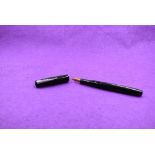 A Mabie Todd & Co Self filler leverfill fountain pen in black with chased design with Warrented 14ct
