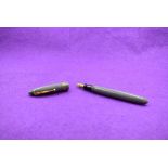 A Mabie Todd & Co Swan 4230 Leverless fountain pen with button fill having two narrow and one