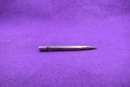 A hallmarked silver mechanical pencil marked JM& Co. Engraved