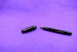 A Mabie Todd & Co Swan 3260 Calligraph Self Filler Leverfill, in black with two bands to the cap and