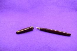 A Conway 150 fountain pen in maroon with a single narrow band to cap having a Conway 1A nib.