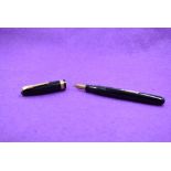 A Watermans 515 leverfill fountain pen in black with single broad band to cap, a Watermand 5 nib,