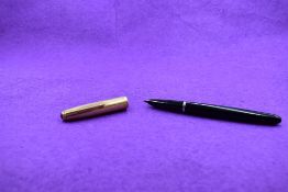 A Parker 51 in black with a gold filled cap