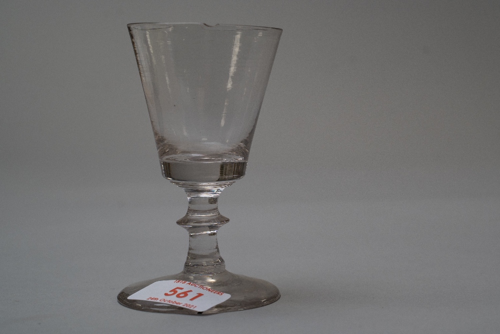 A small Victorian wine glass with central knop to stem.