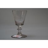 A small Victorian wine glass with central knop to stem.