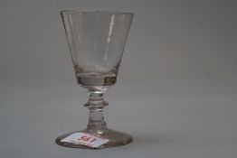 A small Victorian wine glass with central knop to stem.