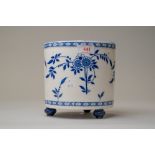A blue and white wear plant or similar pot on three footed base stamped for Minton 16cm tall 16cm