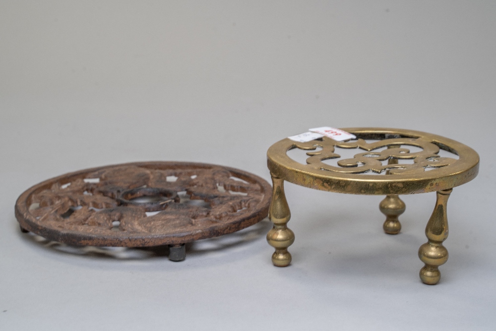 A vintage brass three legged trivet and a antique effect modern trivet with squirrel decoration. - Image 2 of 2