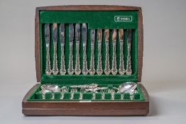 A cased canteen of cutlery by Oneida community plate for serving six in a fitted case