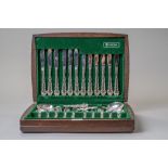 A cased canteen of cutlery by Oneida community plate for serving six in a fitted case