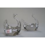 A pair of glass swans.