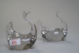 A pair of glass swans.