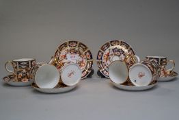 Six Royal Crown Derby coffee cans and saucers in the Imari palette,all in good order with some