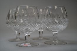 A set of four Waterford brandy glasses with hobnail and cut panels to the bowls.