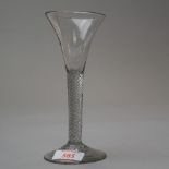 A drawn trumpet bowl wine glass with air twist stem on plain foot