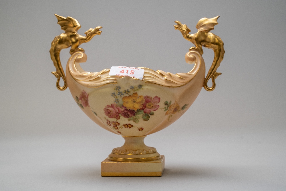 A Royal Worcester dragon boat or fruit bowl having a footed base with hand decorated floral work