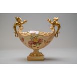 A Royal Worcester dragon boat or fruit bowl having a footed base with hand decorated floral work