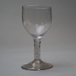 A wine glass with central opaque twist surrounded by multi strand twist with plain bowl and foot