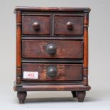 An apprentice piece of miniature furniture early 20th century of a chest of two over two drawers