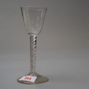 A mid 18th century wine glass with air twist stem