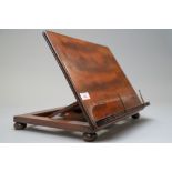 A late Victorian book rest or fold away lectern in mahogany with brass fitments 36cm wide 26cm