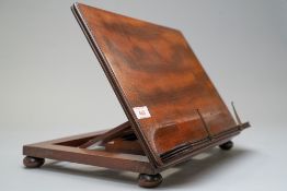 A late Victorian book rest or fold away lectern in mahogany with brass fitments 36cm wide 26cm
