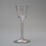 A mid 18th wine glass having multi strand opaque twist stem on plain foot