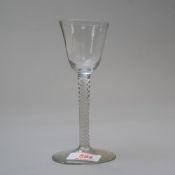 A mid 18th wine glass having multi strand opaque twist stem on plain foot