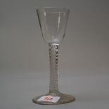 A circa 1750 wine glass having plain foot and stem with multi opaque spiral twist and plain bowl.