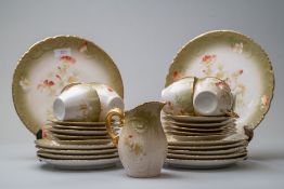 A selection of antique cups and saucers,plates and a jug, having cream and green ground with