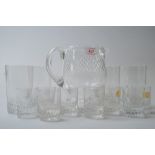 A selection of glassware including a water jug and four tumblers also nine smaller glasses, some