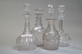 A set of four dissimilar decanters, Georgian with mushroom stopper,three rings to the neck and