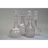 A set of four dissimilar decanters, Georgian with mushroom stopper,three rings to the neck and