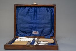 A vintage wooden boxed fruit knife set comprising of six knives and forks.