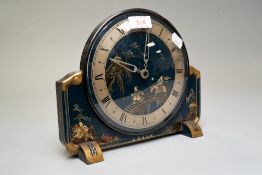 An art deco chinoiserie mantle clock made by Armstrong of Manchester having highly decorated face