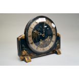 An art deco chinoiserie mantle clock made by Armstrong of Manchester having highly decorated face