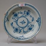 A late 18th century English delft plate or soup bowl in traditional blue and white design with