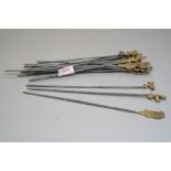 A selection of antique fire side toasting forks having decorative brass figural handles