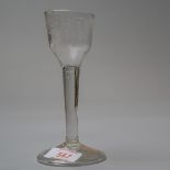 A circa 1720 wine glass with plain stem on domed and folded foot having etched vine decoration to