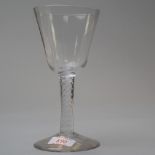 A mid 18th century multi opaque twist stem with an ogee bowl