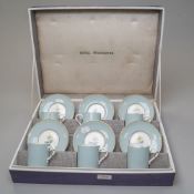 A cased six serving coffee set by Royal Worcester having the Woodland design